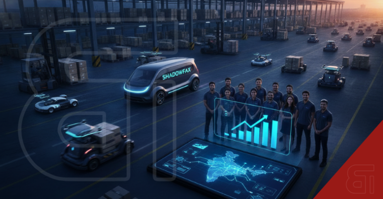 Futuristic Shadowfax logistics hub with delivery EVs, drones, and a team viewing holographic charts and an India map.